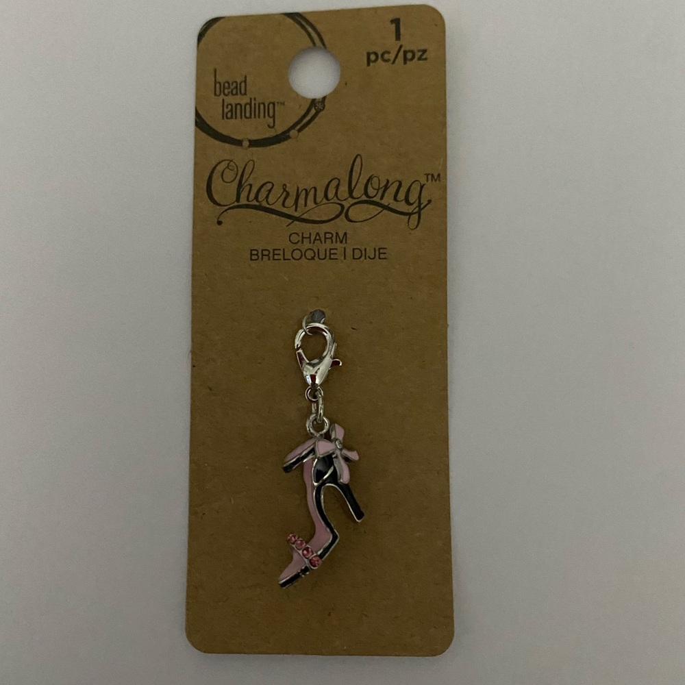 A clip on charm of a high heel shoe. New